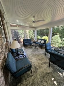 Finished screened porch with beadboard ceiling, ceiling fan, stamped concrete floor, brick wall — Littlebrook screened porch in Clemmons, NC