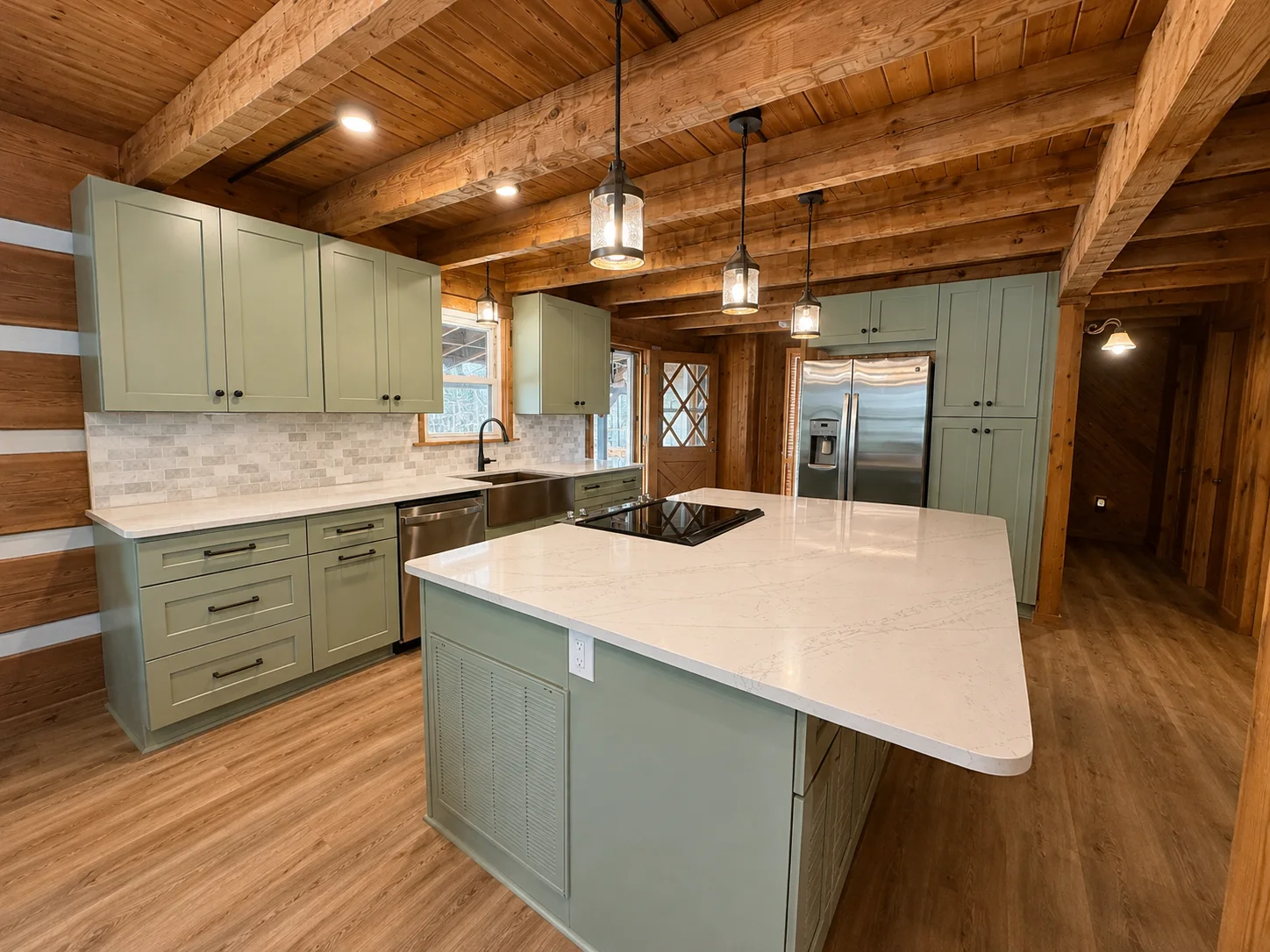 Modern log cabin kitchen with white quartz island, sage green shaker cabinets, and exposed log beams — whole-home renovation by Salem Builders